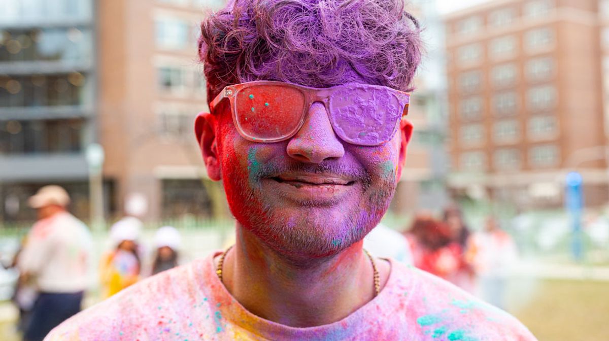 A Loyola student at the holi festival celebration