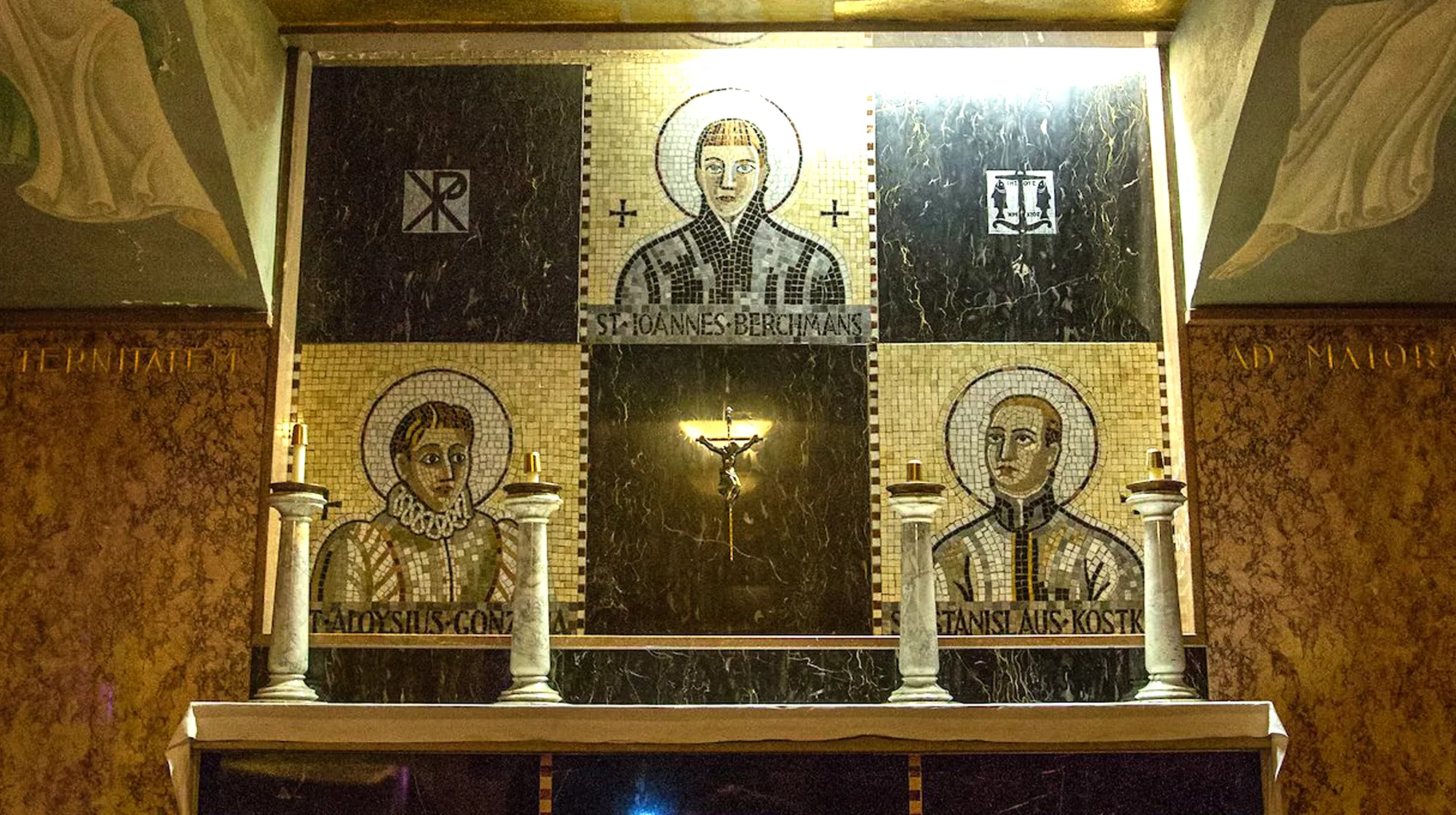 Chapel altar with mosaic artwork of saints and crucifix