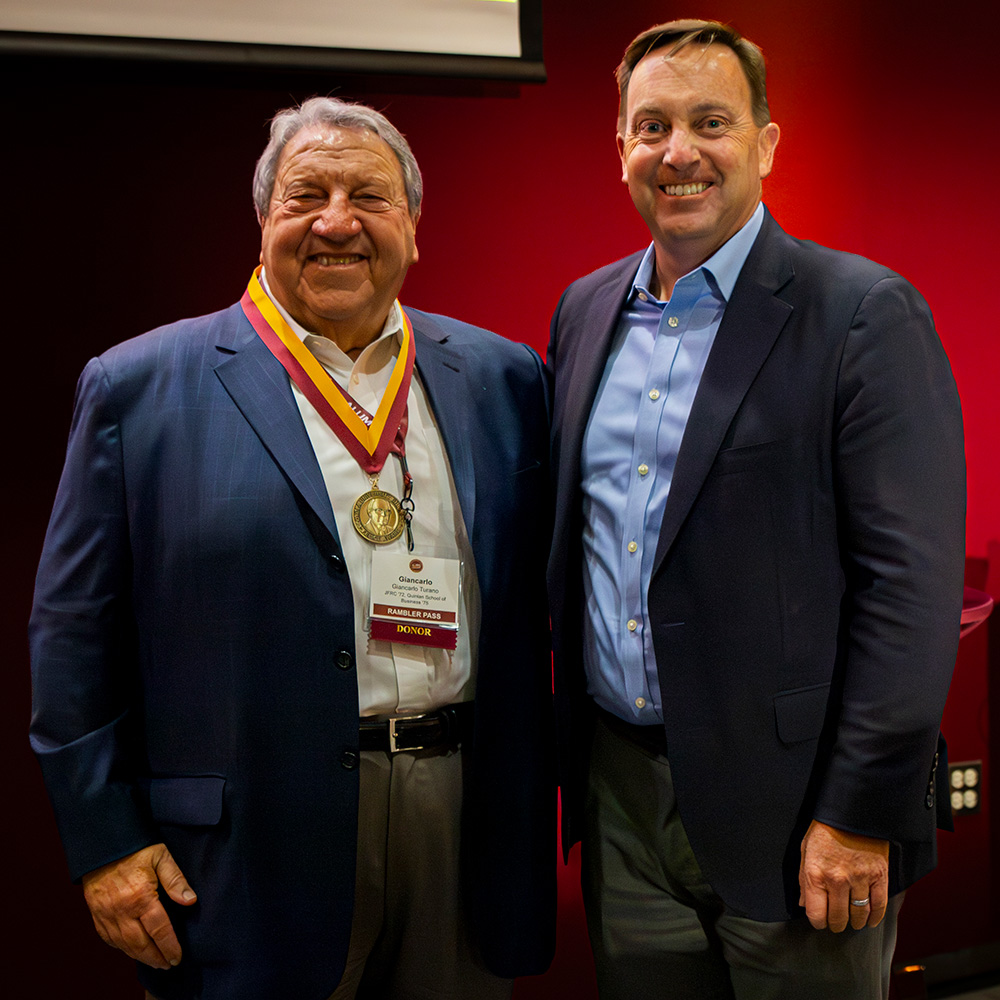 Giancarlo Turano (BBA 75, JFRC 71-72) accepts the 2025 Spirit of Felice Award from Dr Reed.