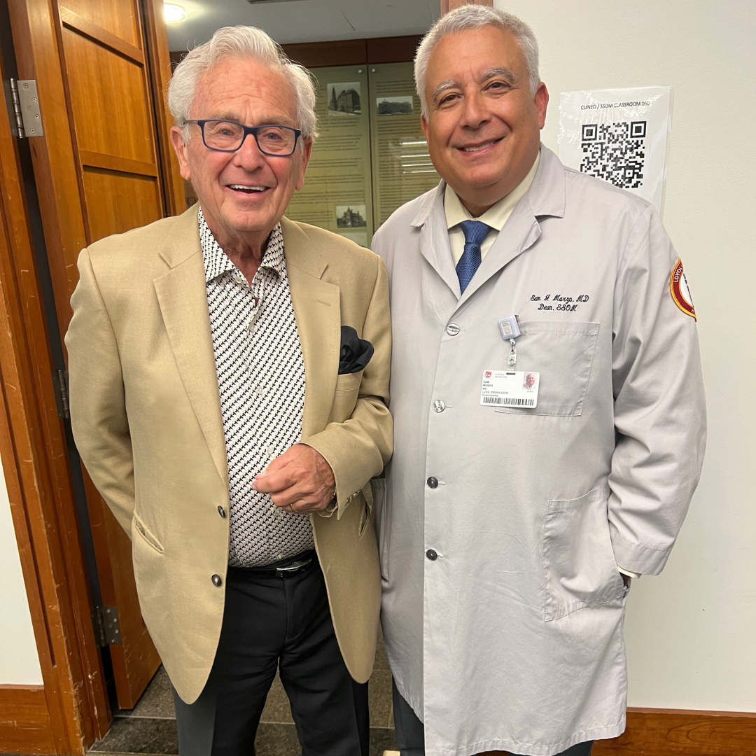 Dennis Gates (M.D. ’65), on the left, and Stritch School of Medicine Dean Marzo, on the right.