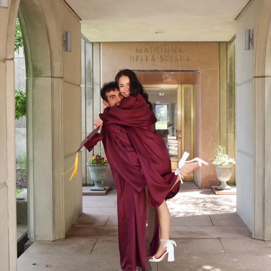 Photo of alumni Valerie and Marco at commencement. 