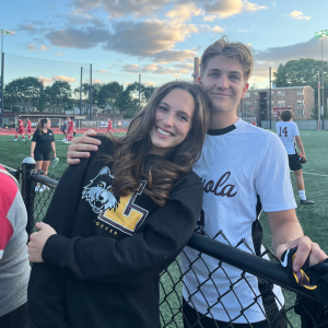 Photo of Eliana and Benni at a soccer match.