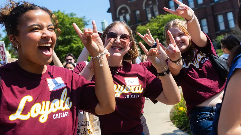 Students cheering at a pep rally.