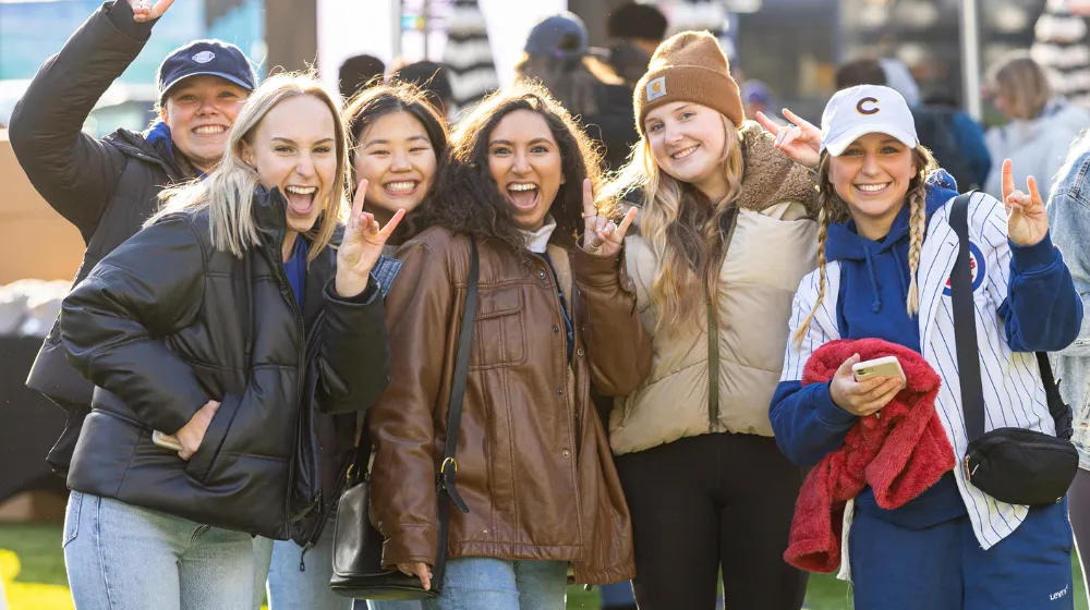 Alumni posing for a photo at an alumni event.