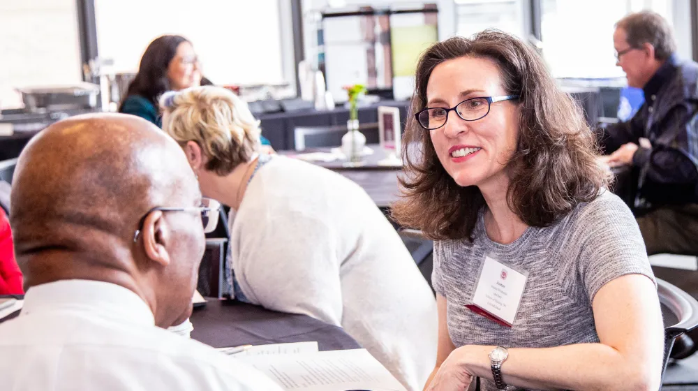 A student chats with an alumni mentor at an event sponsored by LoyolaLinked.