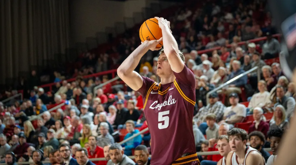 A basketball player shooting a basket.