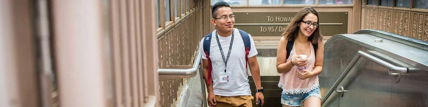 Two Loyola University Chicago students exit the Chicago subway.