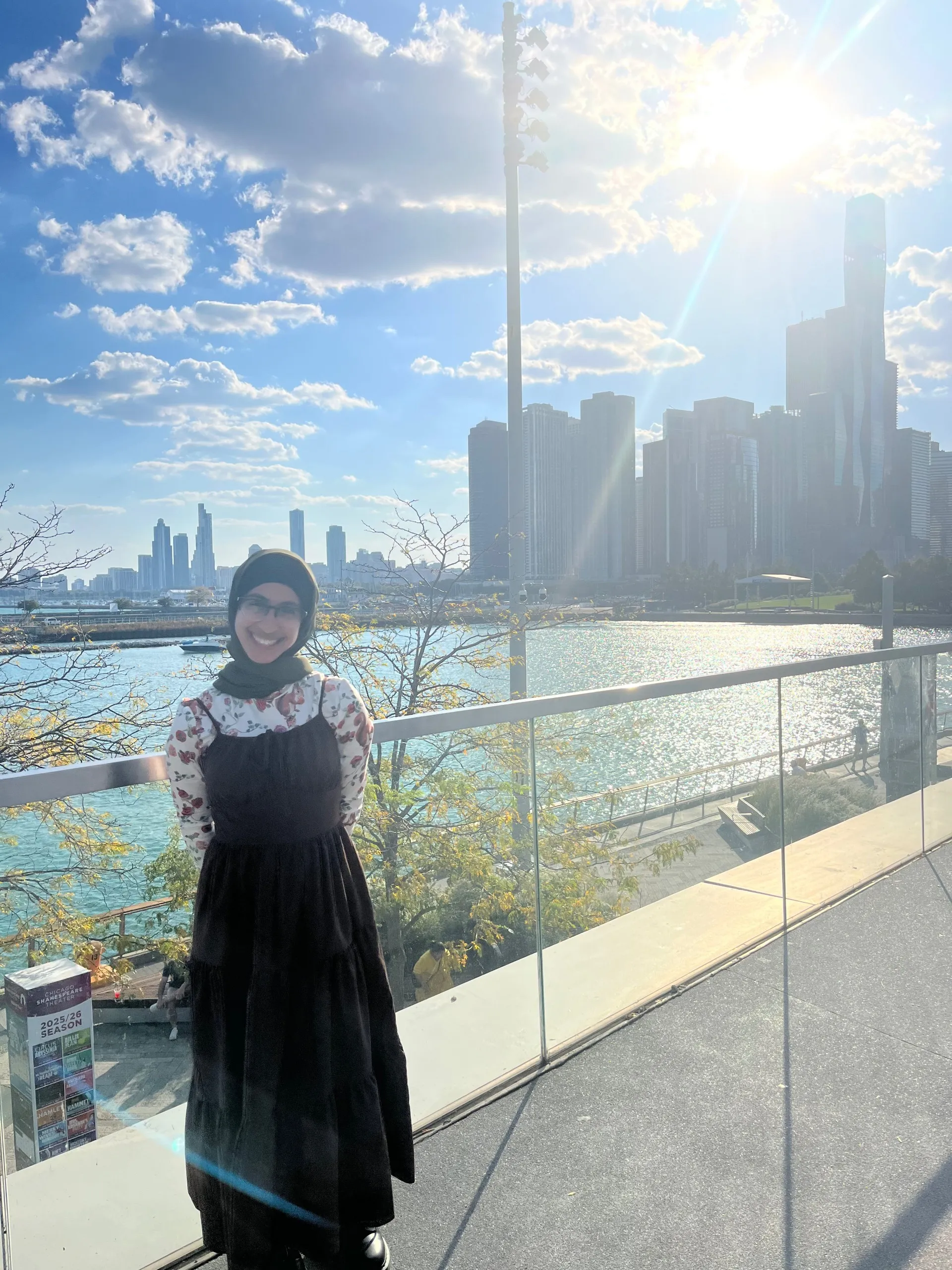 Noman standing in front of the Chicago skyline