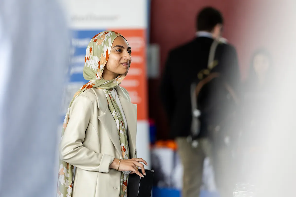Loyola University Chicago student at business networking and career fair at Schreiber Center