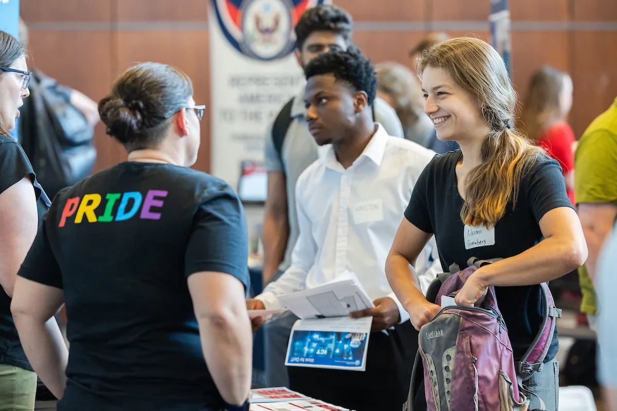 Students and employers at a career fair 