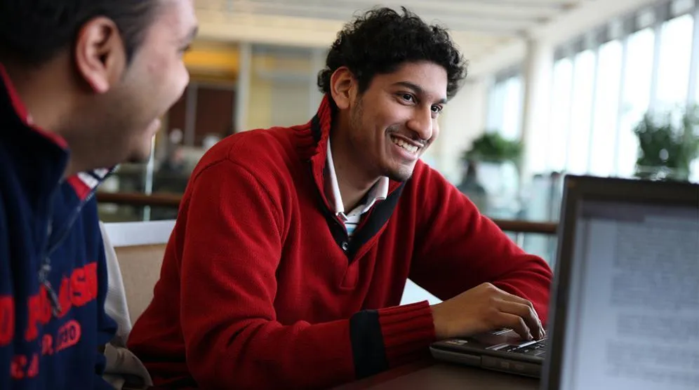 Person smiling at a career fair 