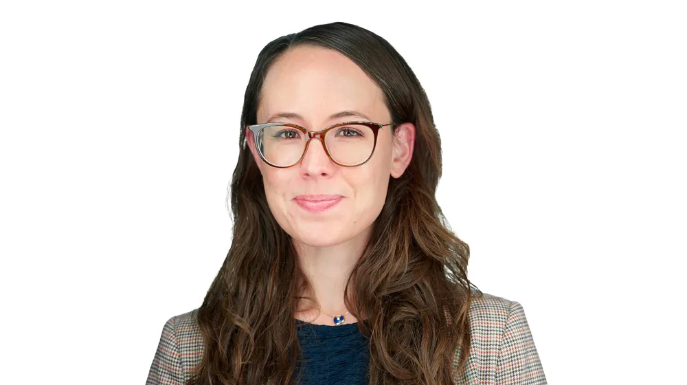 Woman with glasses head shot on white background