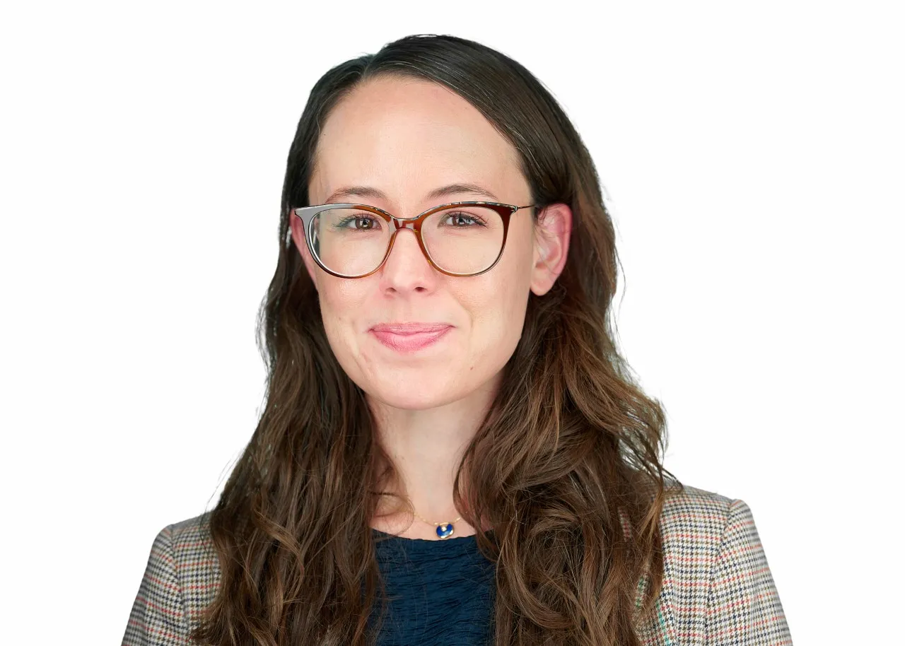 Woman with glasses head shot on white background