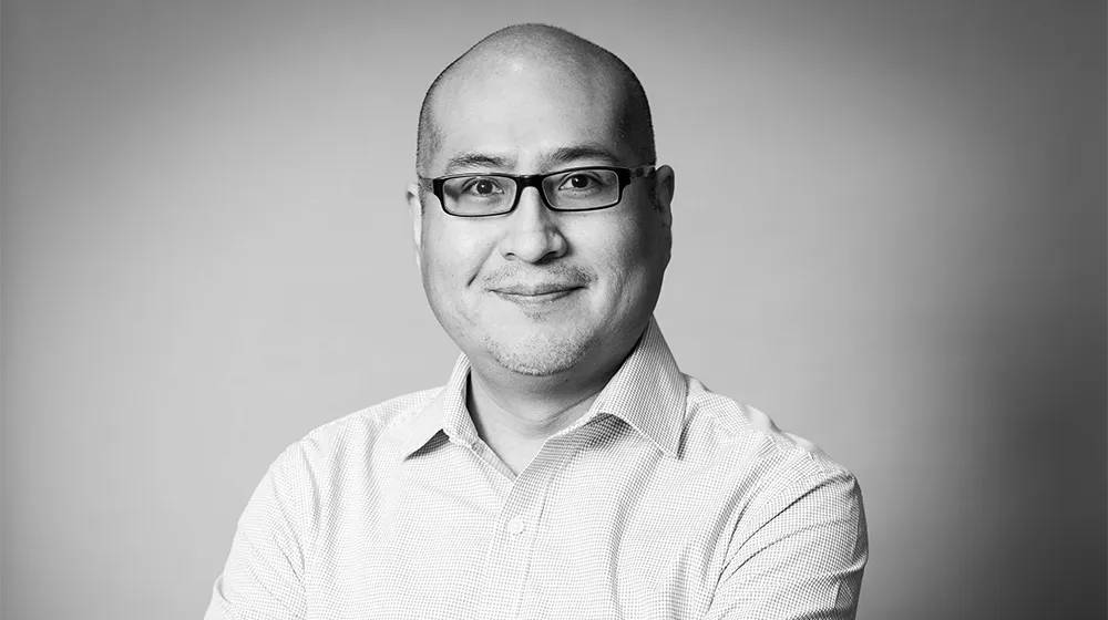 Yas Silva Poses for Black and White headshot 
