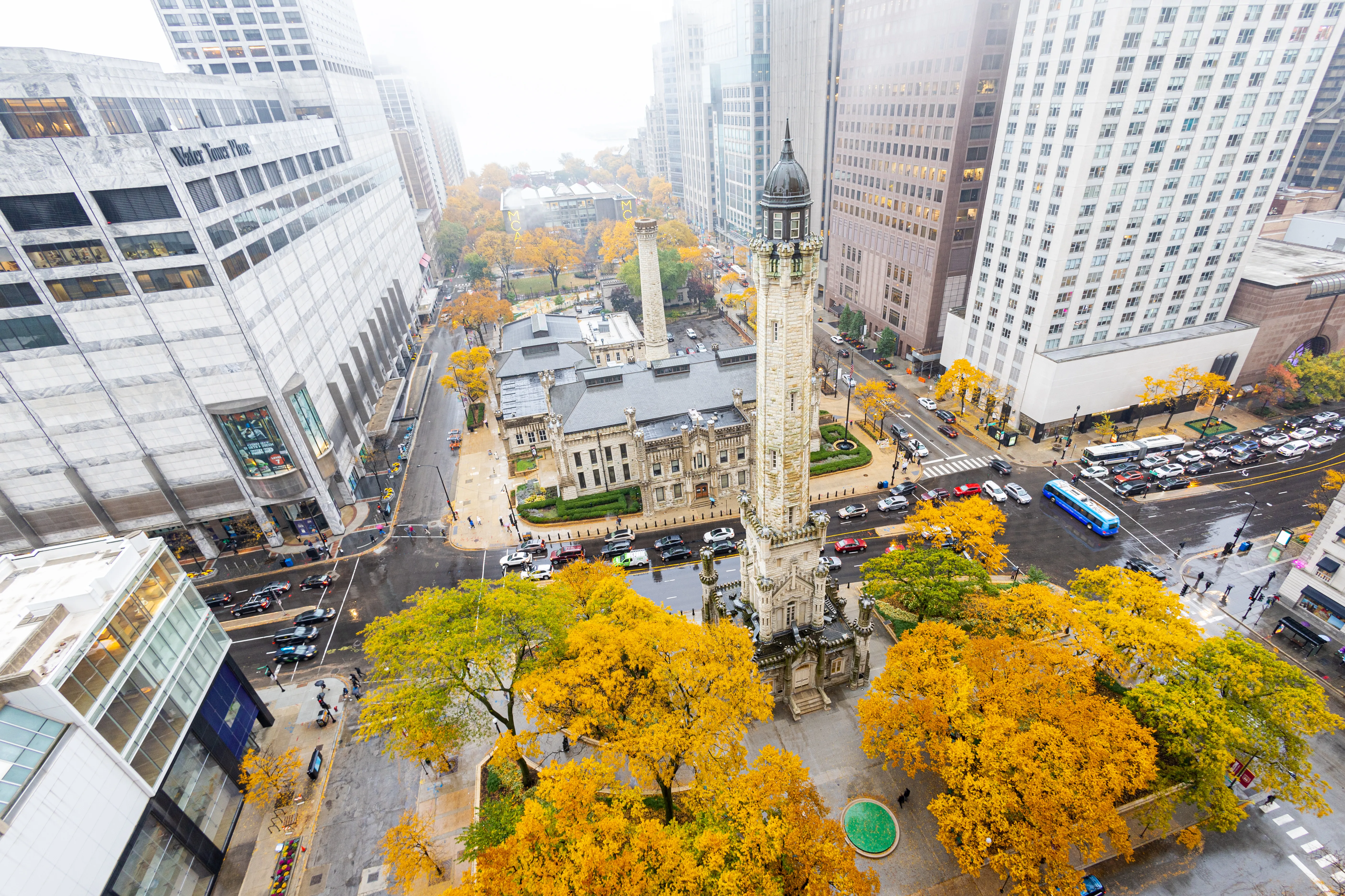 Aerial view of Chicago’s Water Tower and downtown skyline near Loyola’s Water Tower Campus in autumn
