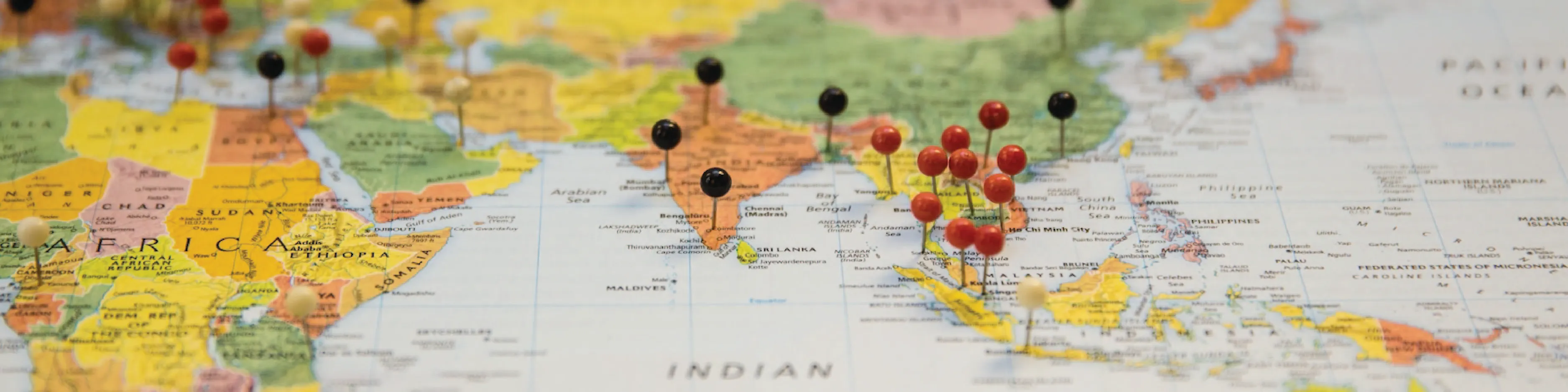 Map of the world with pins in locations