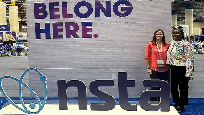 Two female science coaches smiling