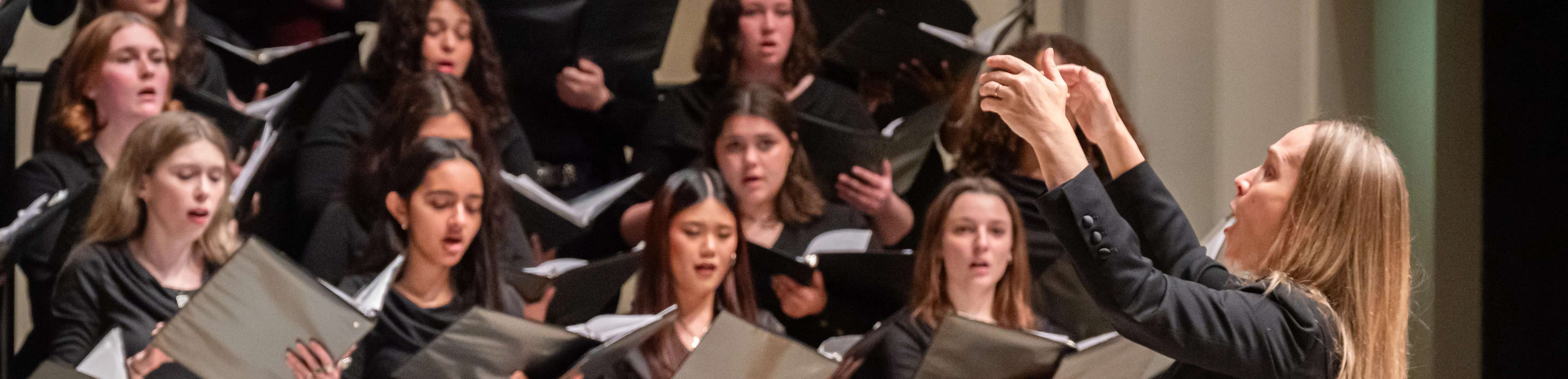 DFPA Chair, Kirsten Hedegaard conducting Loyola Choir Students in Madonna Della Strada
