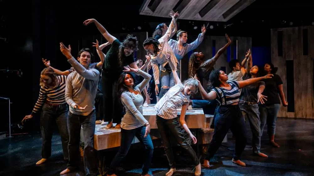 Actors pose onstage in production of Notes From The Field