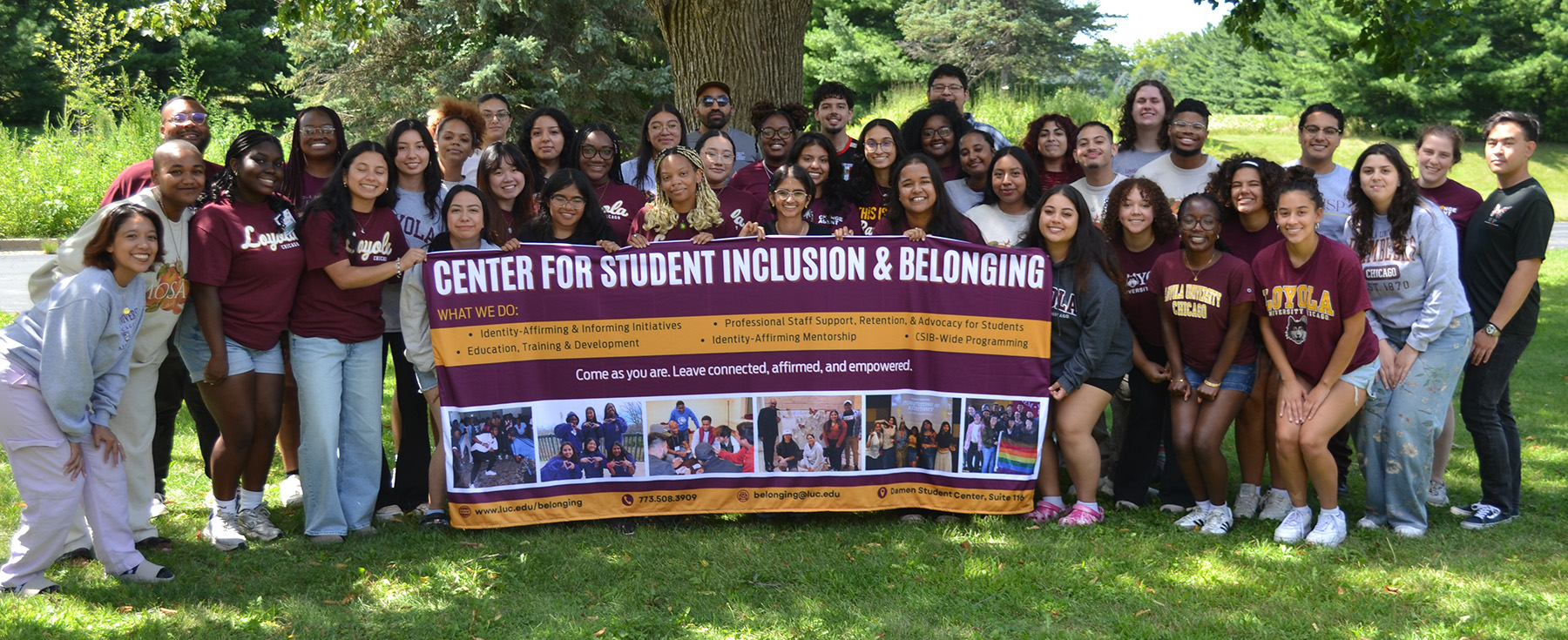 Students and staff pose together for a group photo in nature during the Leader Retreat.