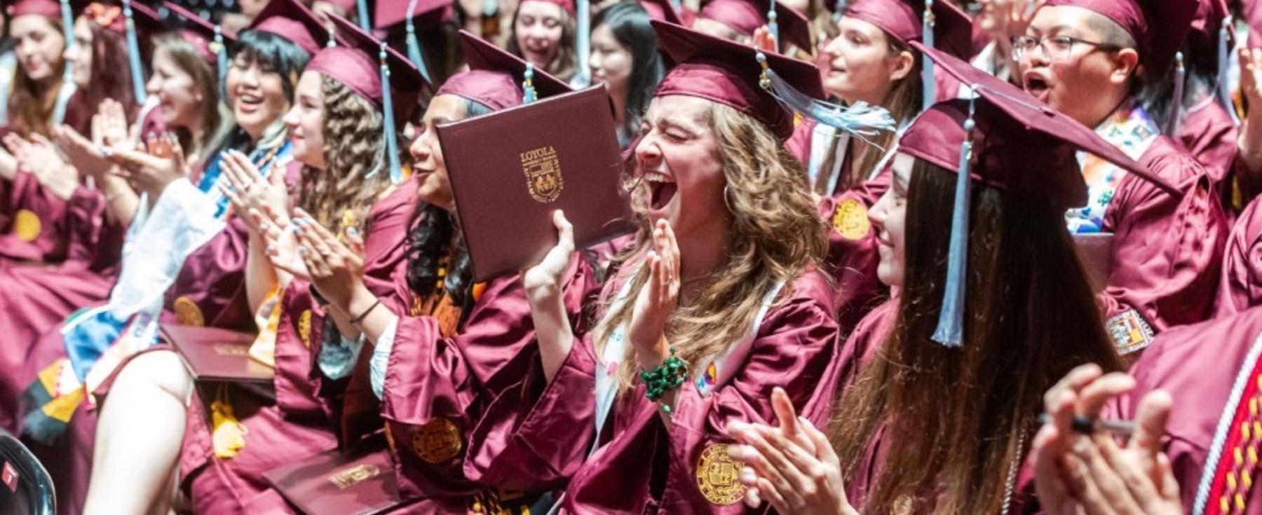 Loyola School of Education graduates celebrating at commencement