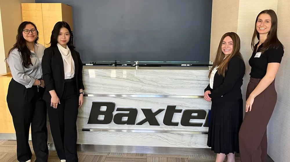 Award winning engineering students pose together at sponsor headquarters.