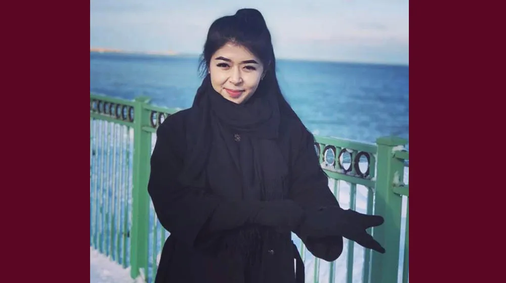 Algerim outside near the lakeshore in the winter