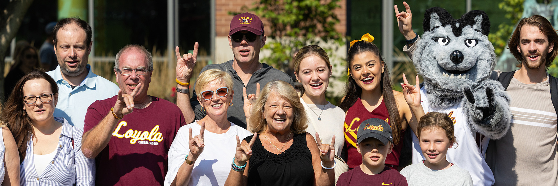 Parents and family members pose with students, the cheer team, and LU Wolf at the Family Weekend welcome reception.