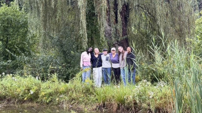 Gannon students stand together in the woods at LUREC.