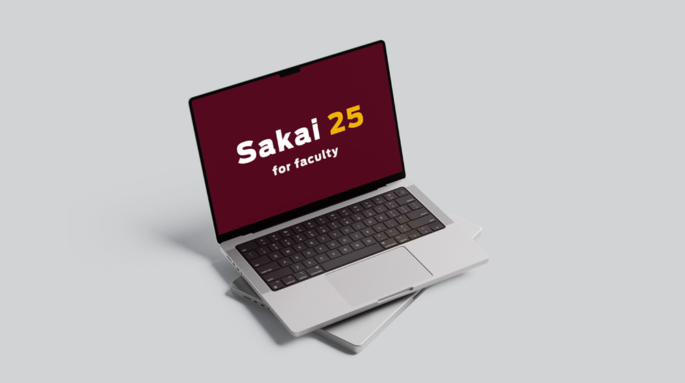 One laptop open with text displaying 