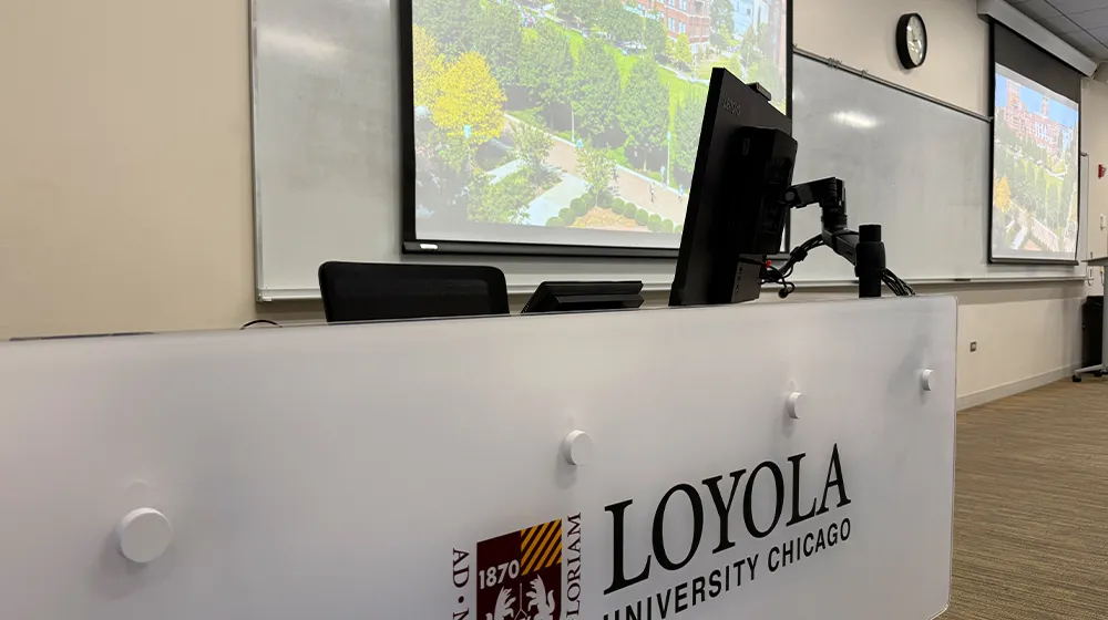 A professor using technology as part of the class lecture experience