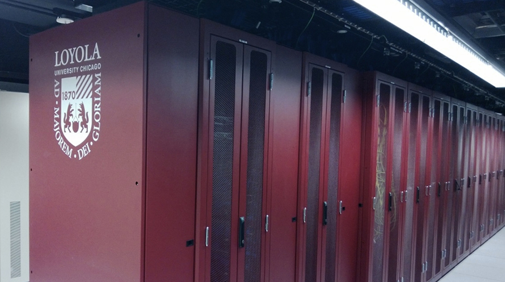 Network infrastructure cabinets in maroon with a Loyola logo visible.