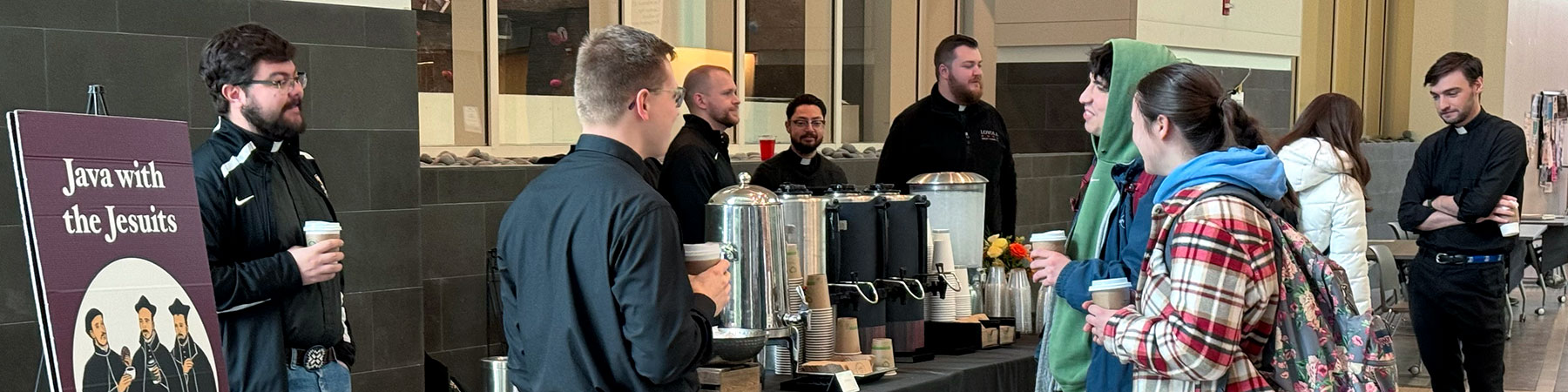 Several students and members of the Jesuit First Studies community participate in a Java with the Jesuits event.