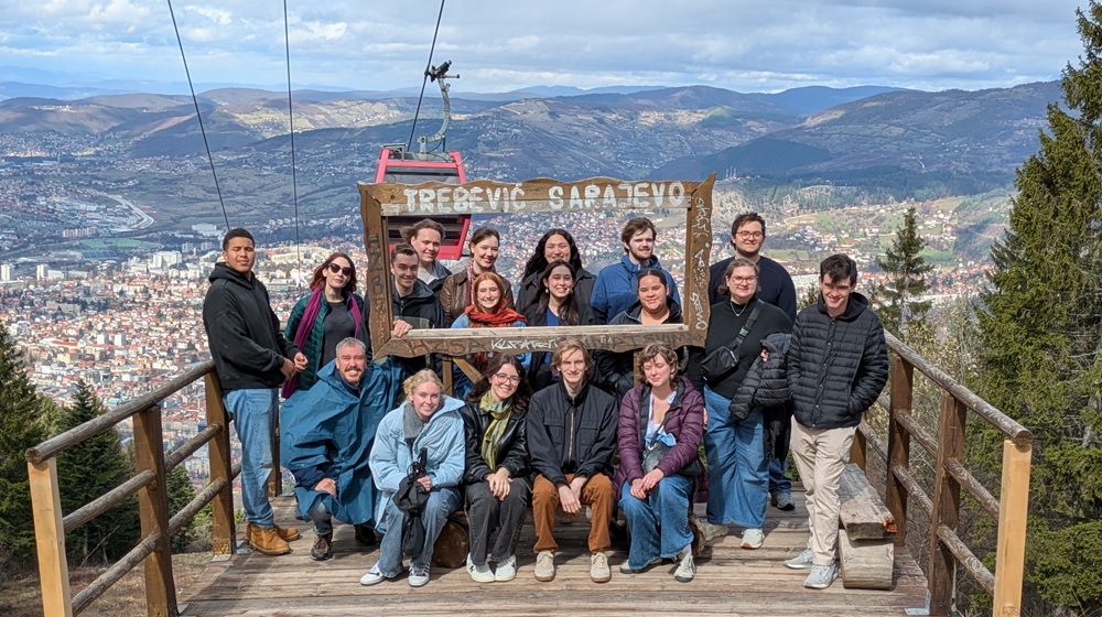 Students pose on Mount Trebević above Sarajevo