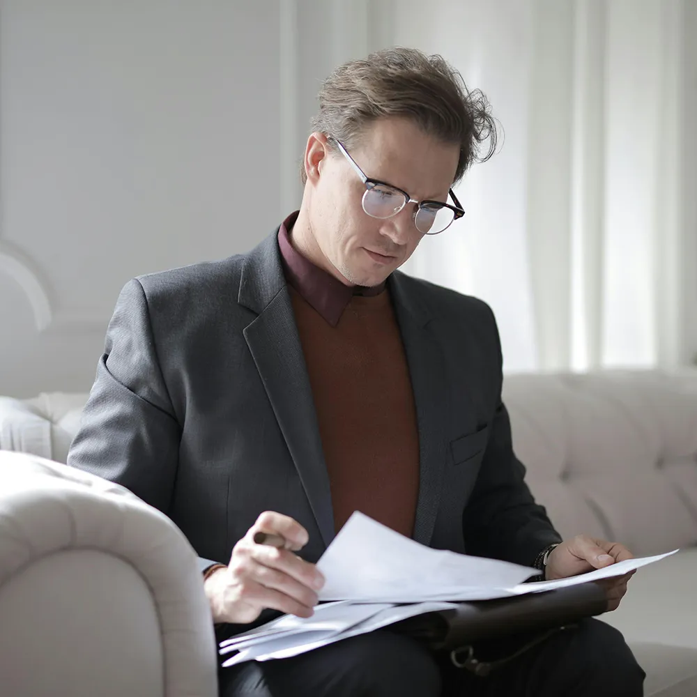 man looking at paperwork