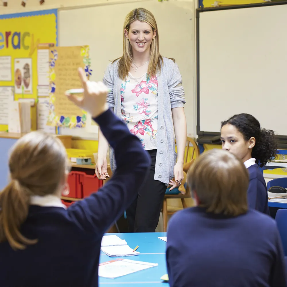 teacher and children in a classroom
