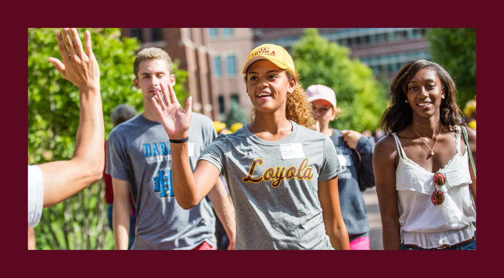 A student giving a high five. 