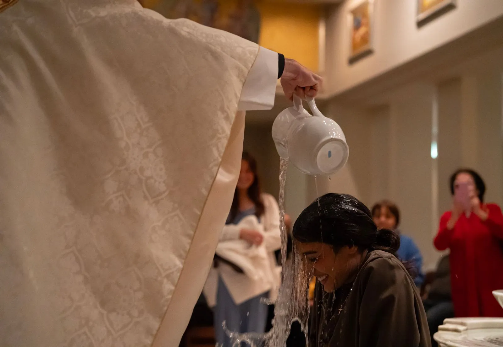 Baptism of college student at Easter Vigil 