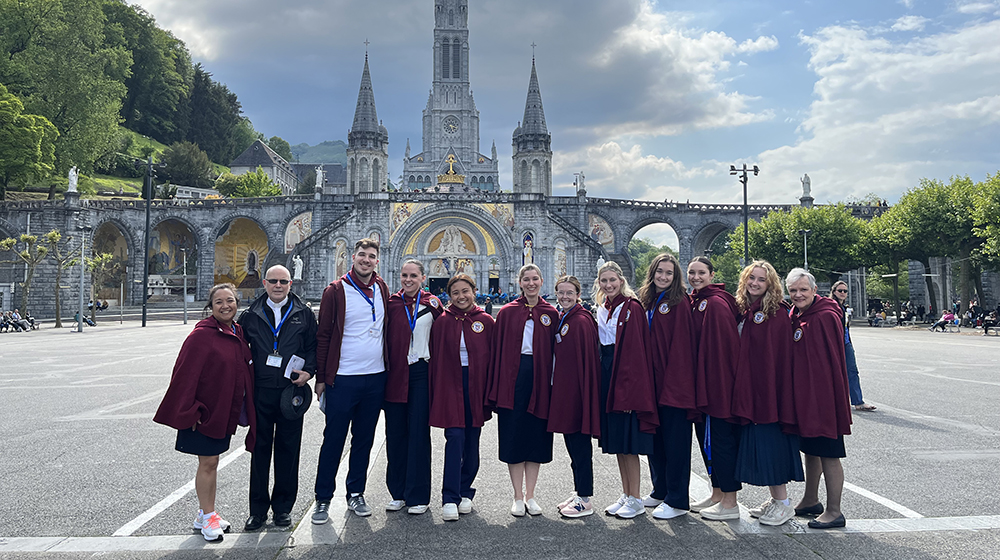 Students pose in front of a cathedral in Lourdes Students pose in front of a cathedral in Lourdes