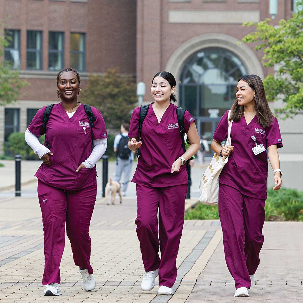 Loyola University Chicago nursing students walking through the HSC