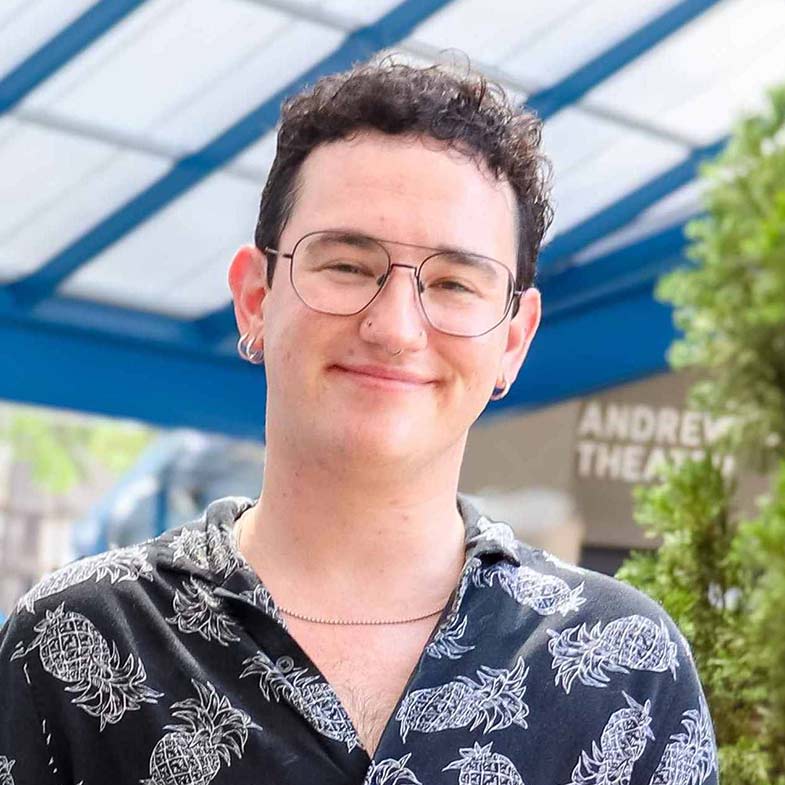 Ezra Imes standing in a sunny building