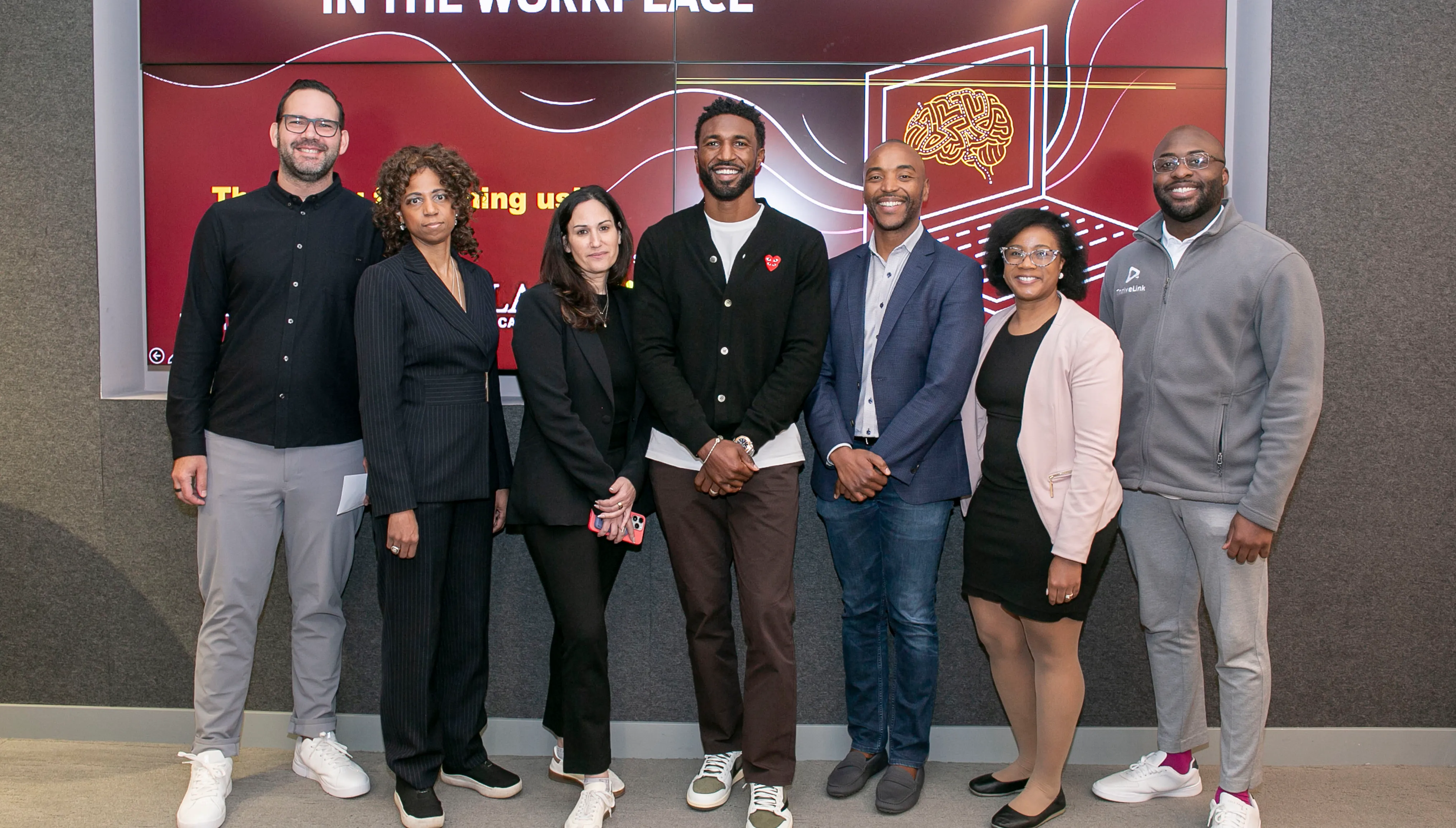 Seven finalists standing in front of Health Equity Quest screen