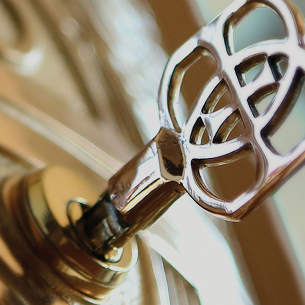 A close up of a brass key