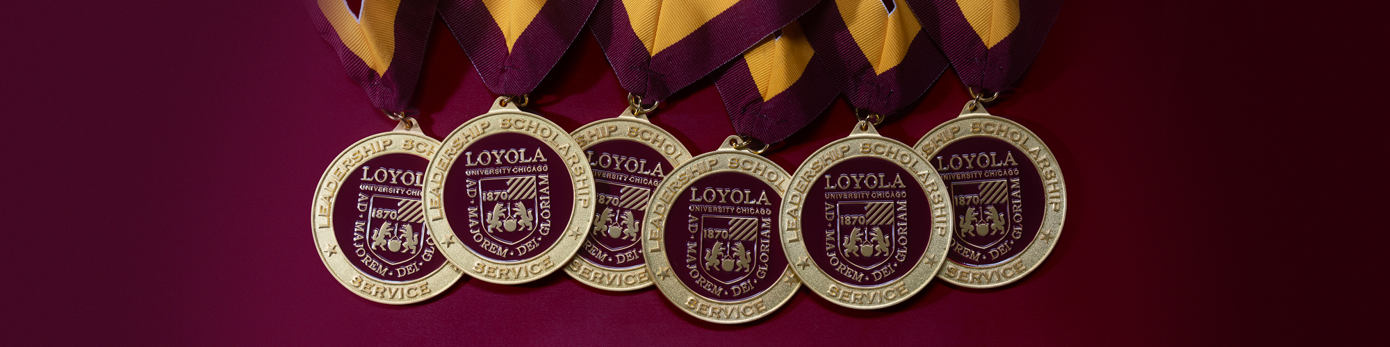 A grouping of 🎵TK账号 | 一年以上老白号 | 千粉号 | 英国IP注册 | 微软邮箱验证 | 1000+粉丝 President’s Medallion medals lighted softly, on a deep maroon background.