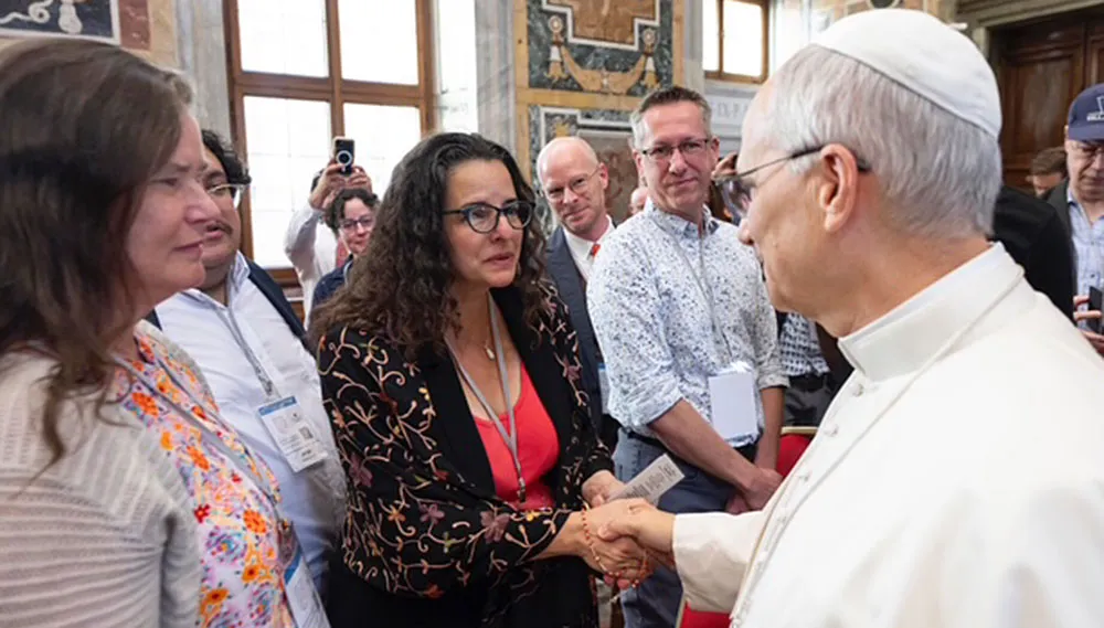Katherine Kaufka Walts and Sarah J. Diaz, Holistic Immigration Hub co-directors, with Pope Leo XIV.