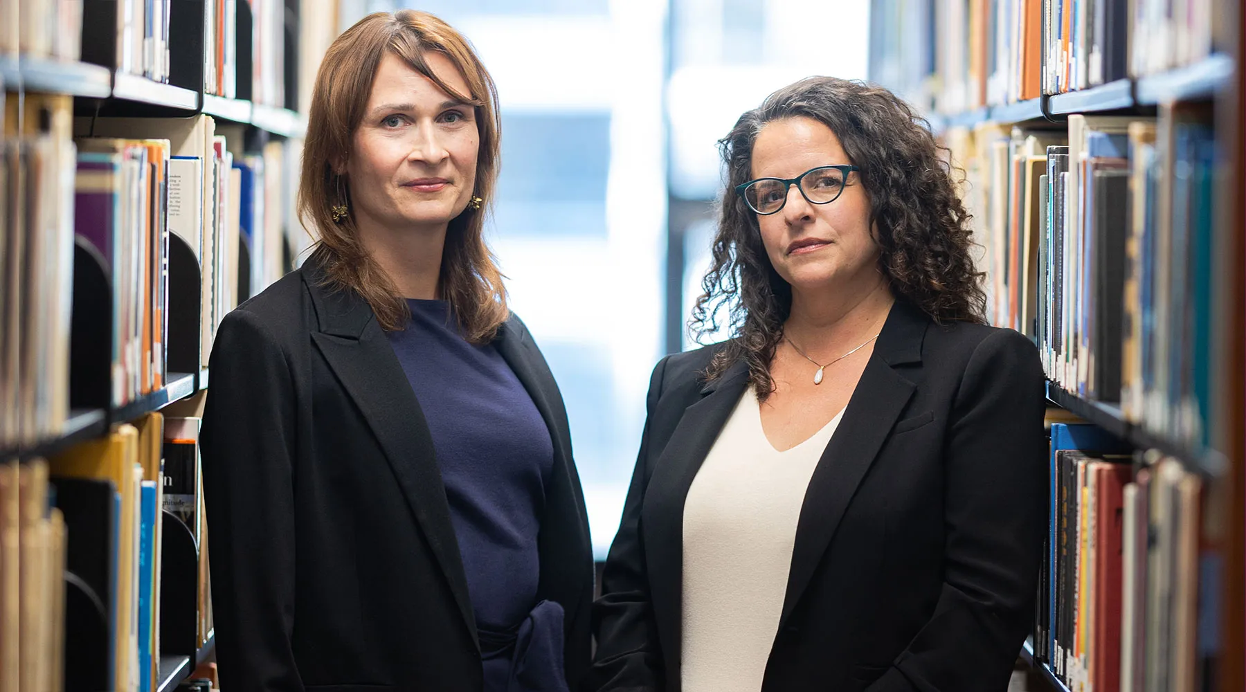 Katherine Kaufka Walts and Sarah J. Diaz, Holistic Immigration Hub co-directors stand side by side.