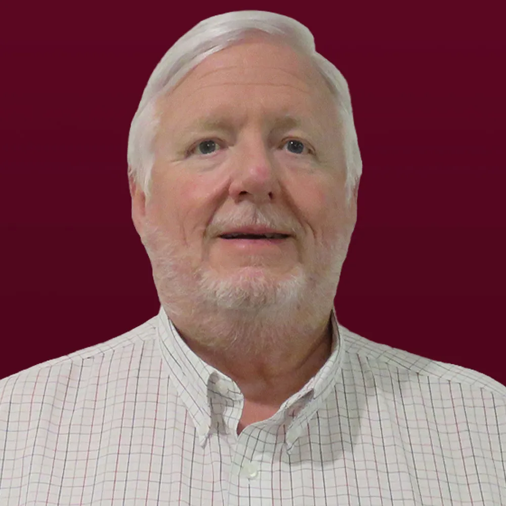 Bob Buddig headshot against maroon background