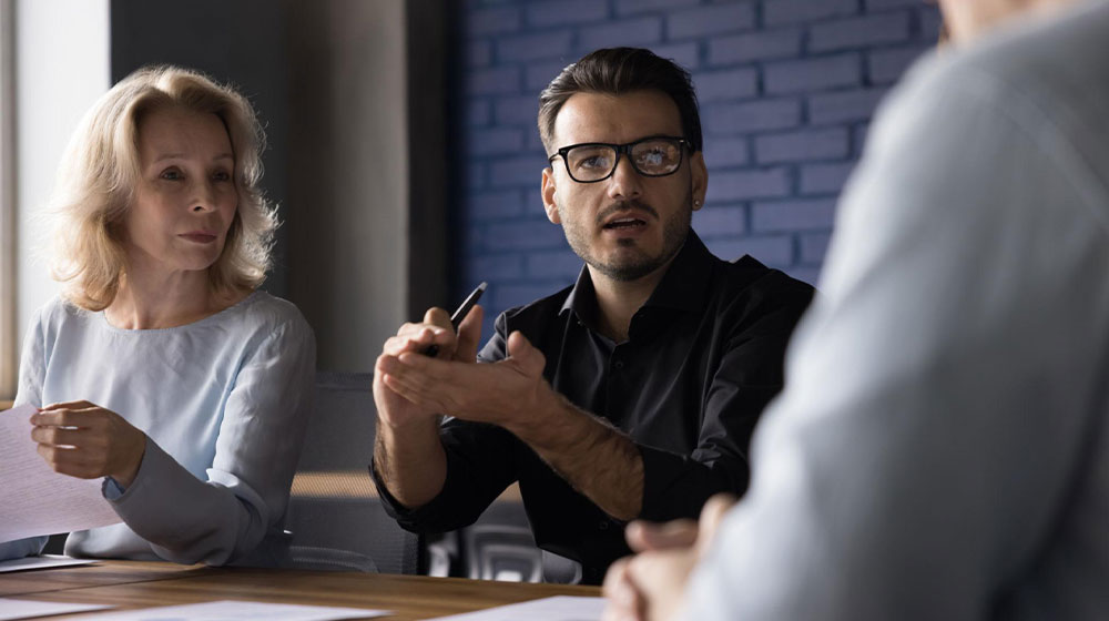 Man in a meeting with family business members