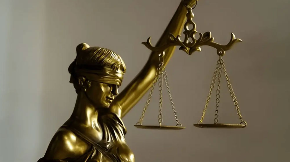 Gold Lady Justice Statue Holding Scales