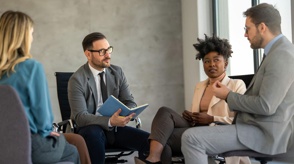 Group of family business members speaking to a lawyer